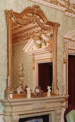 A beautiful dining room decorated with wall brackets and statuary for an additional feature